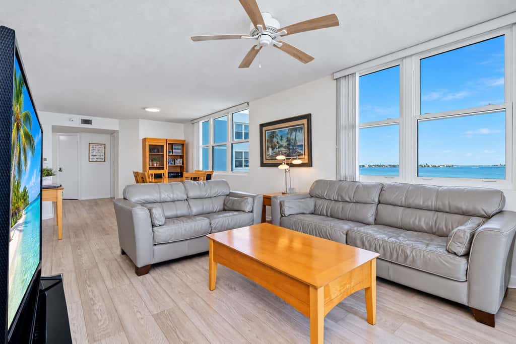 Water view condo with private beach pool and hot tub snowbird friendly