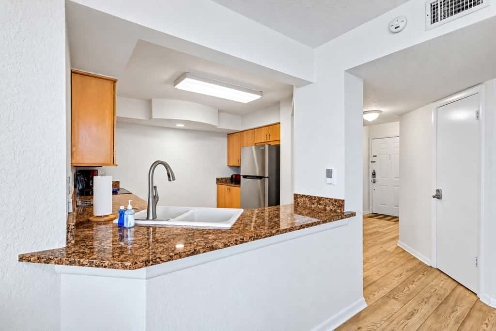 Water view condo with private beach pool and hot tub snowbird friendly