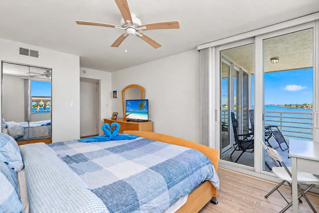 Water view condo with private beach pool and hot tub snowbird friendly