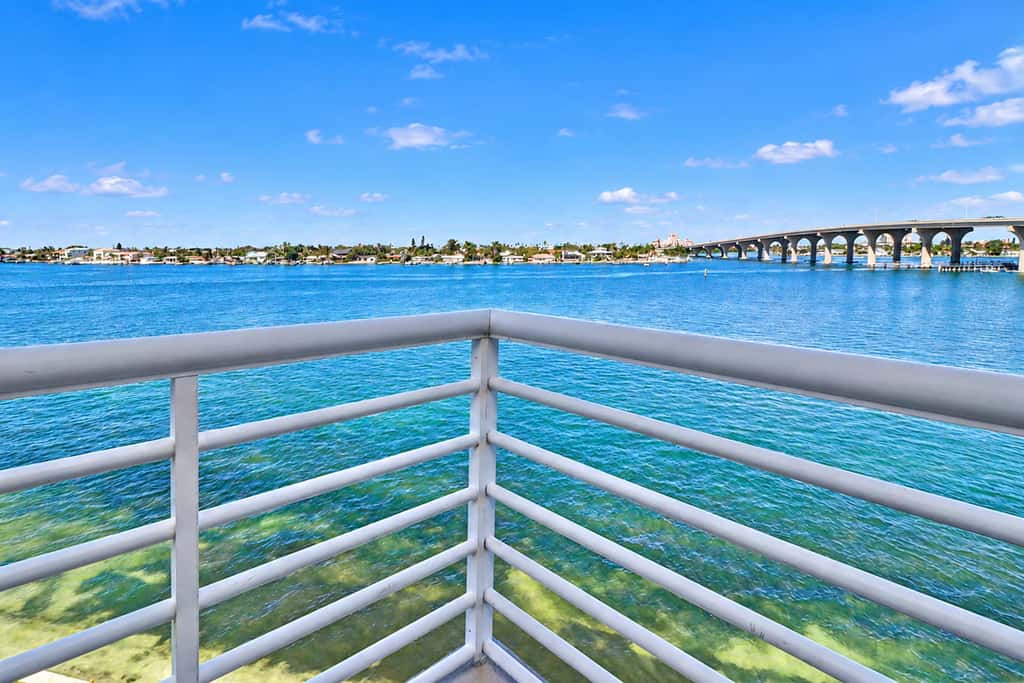 Water view condo with private beach pool and hot tub snowbird friendly