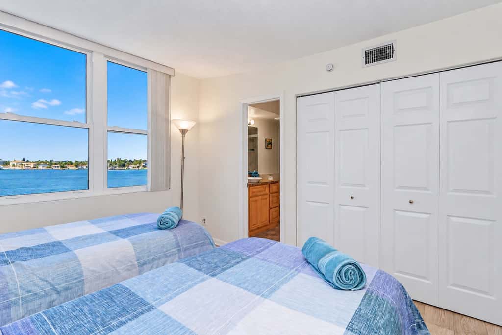 Water view condo with private beach pool and hot tub snowbird friendly