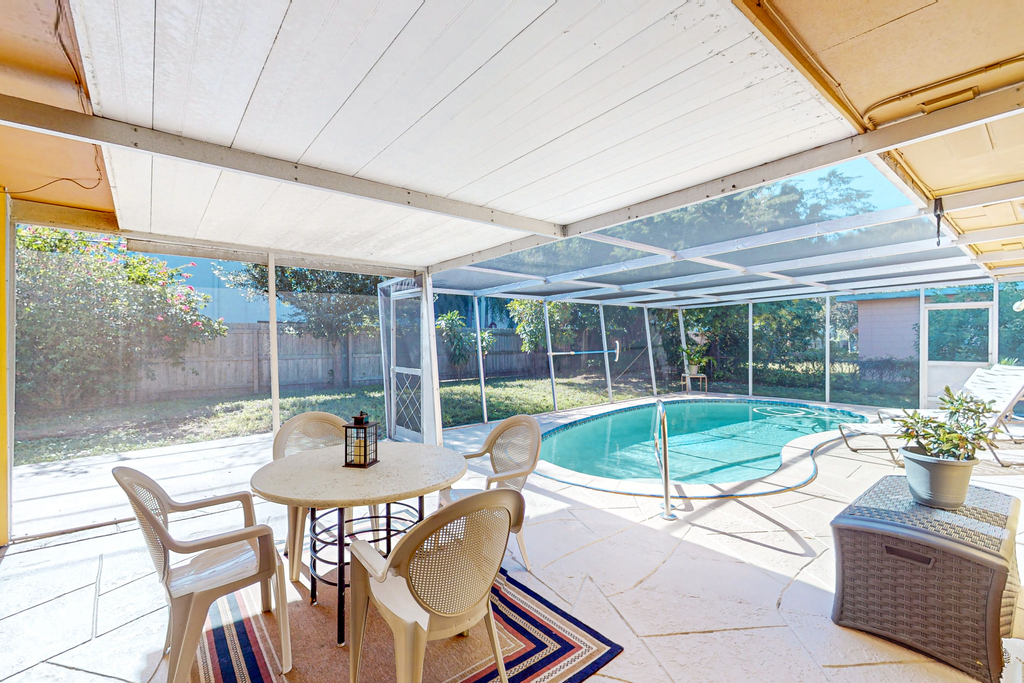Single story home near beach with heated private pool enclosed yard Dogs ok