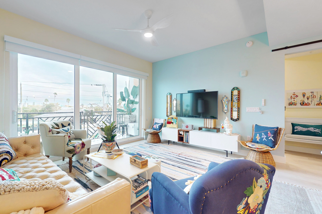 Sunlit and colorful beach condo with heated pool hot tub and balcony near shore and shops