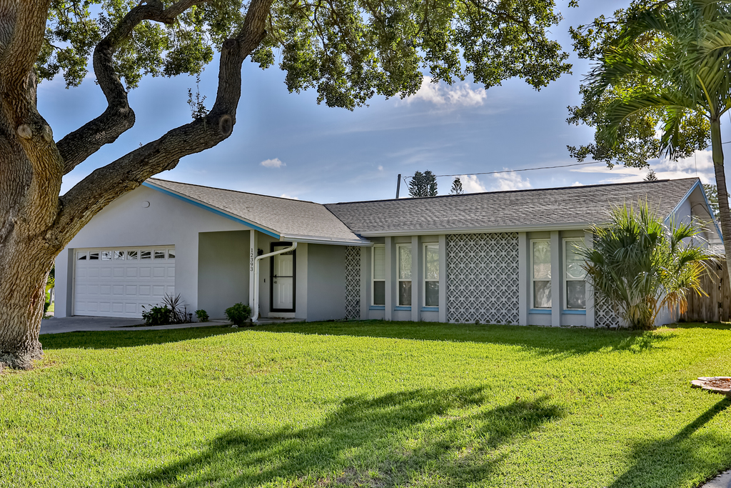 Modern coastal getaway with pool enclosed yard grill and outdoor bar