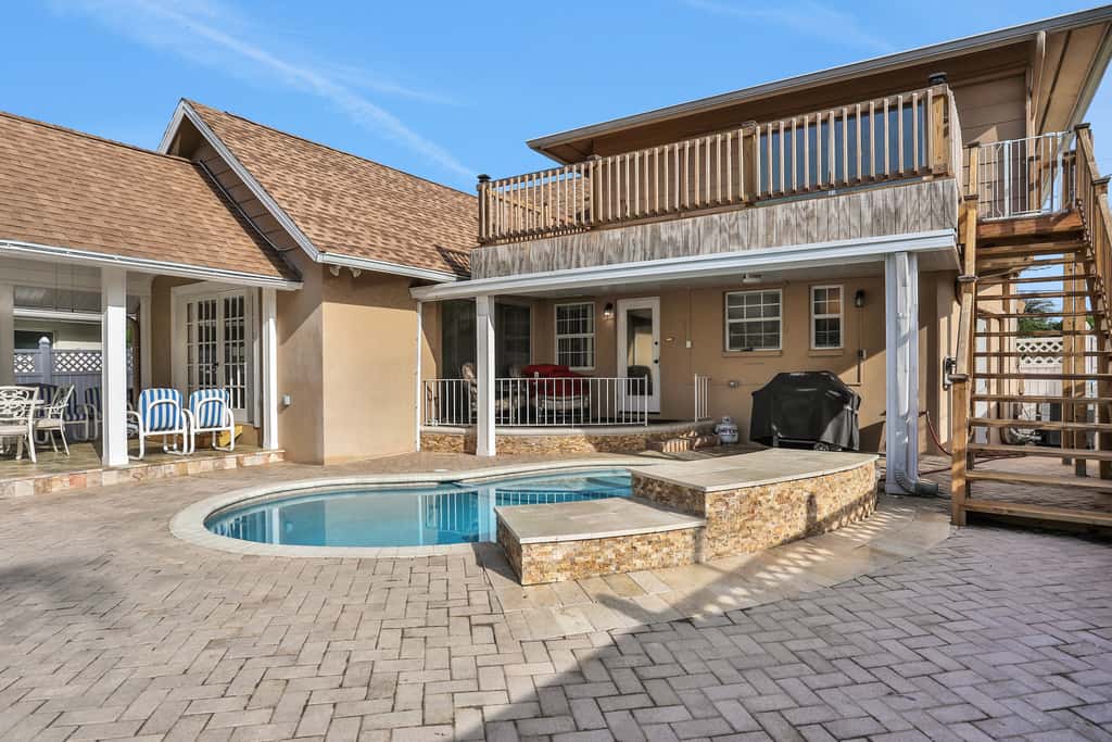 Snowbird friendly elegant home with waterfront location pool grill fireplace