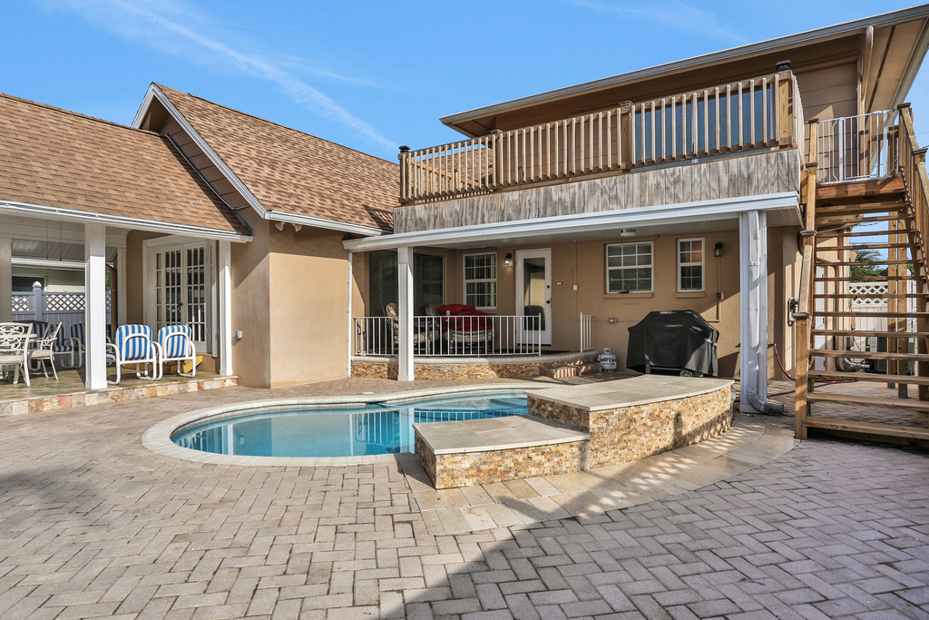 Snowbird friendly elegant home with waterfront location pool grill fireplace