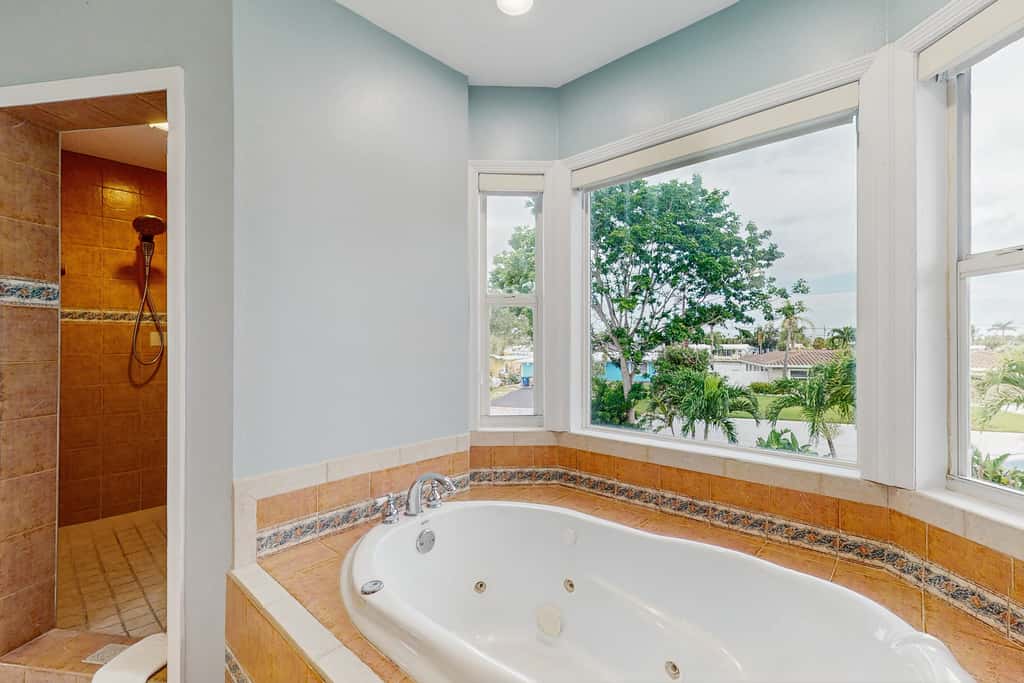 Waterfront home with private pool deck and patio 1/2 mile to the beach
