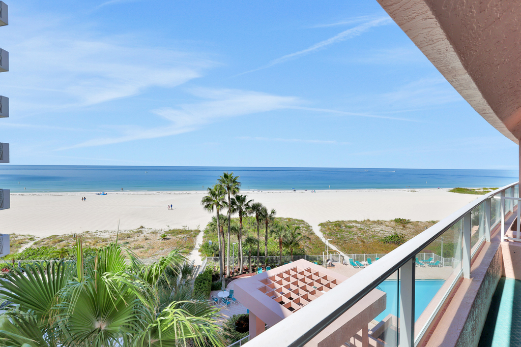 Beachfront condo with multiple balconies heated pool gym hot tub and AC