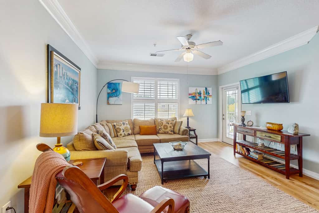 Golf community condo near beach with on-site pool, golf, & screened balcony