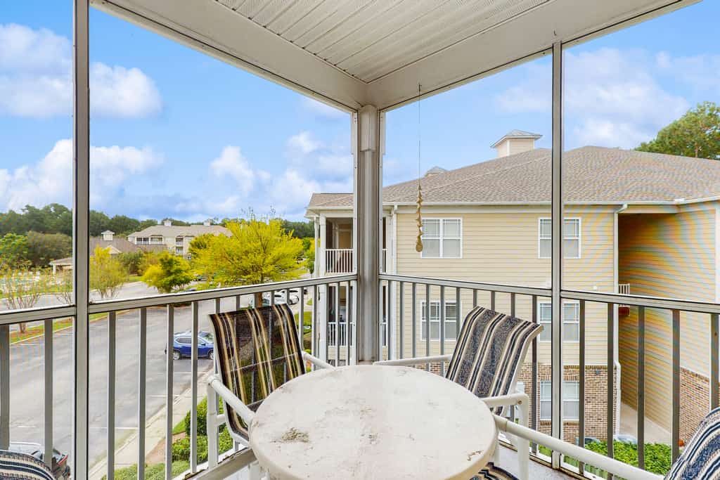 Golf community condo near beach with on-site pool, golf, & screened balcony