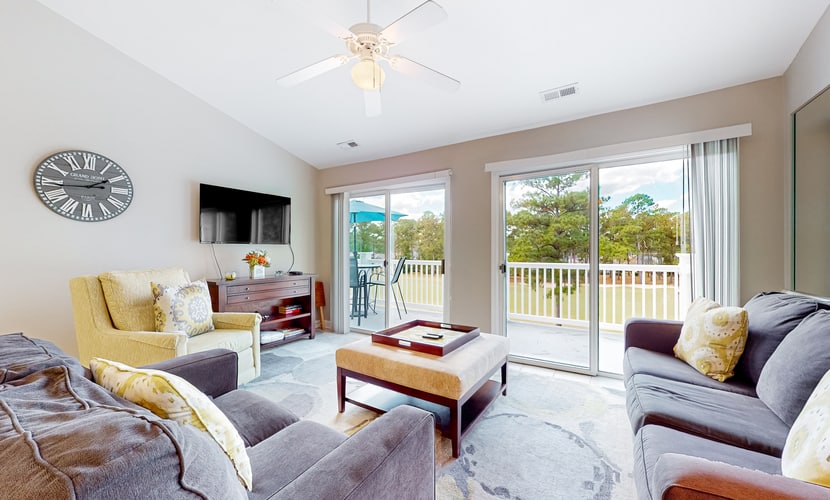 Coastal condo with golf course views, on-site pools, gym, & balcony