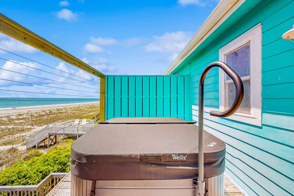 Oceanfront duplex with lovely interior, large deck, hot tub, AC & W/D