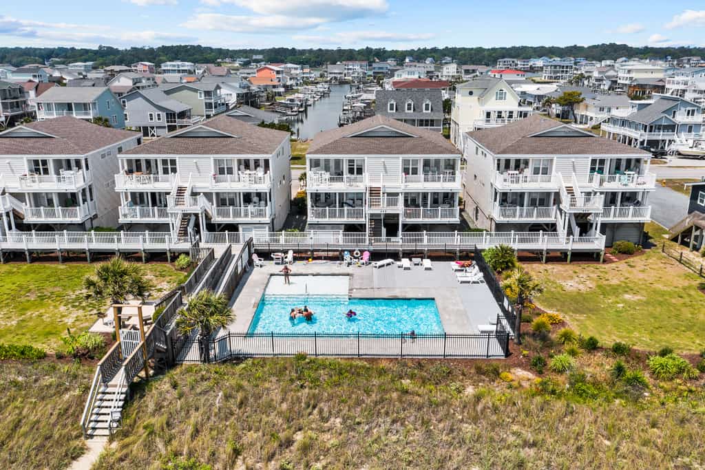 Lower Waterfront Condo with Oceanfront Balcony, Shared Outdoor Pool, WiFi & AC