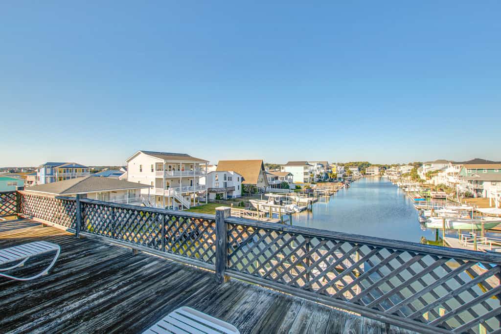 Waterfront home across the street from the beach with WiFi, AC, W/D, and deck