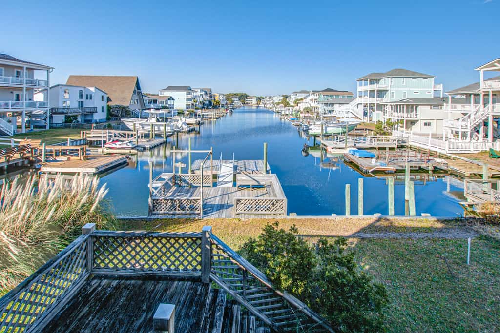 Waterfront home across the street from the beach with WiFi, AC, W/D, and deck