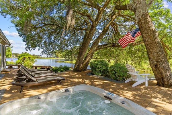 Shining Waters: Gorgeous waterfront home with private hot tub, pool, views, deck, & fireplace
