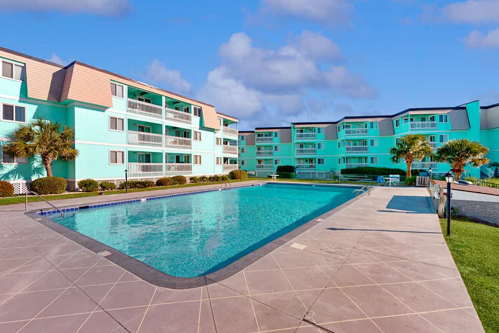 Ocean-view condo with beach access, WiFi, pool, washer/dryer, & AC