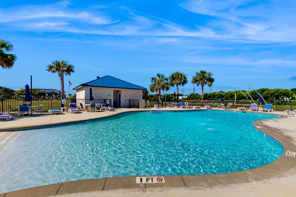 Ocean view condo with shared pool, fitness room, & balcony