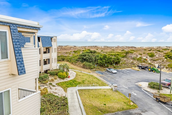 Beachfront home base with ocean-view balcony, 2 pools, waterslide & beach access