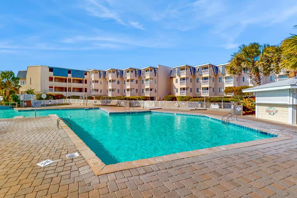 Great ocean-view condo with beach access, pool, sports courts, & private balcony