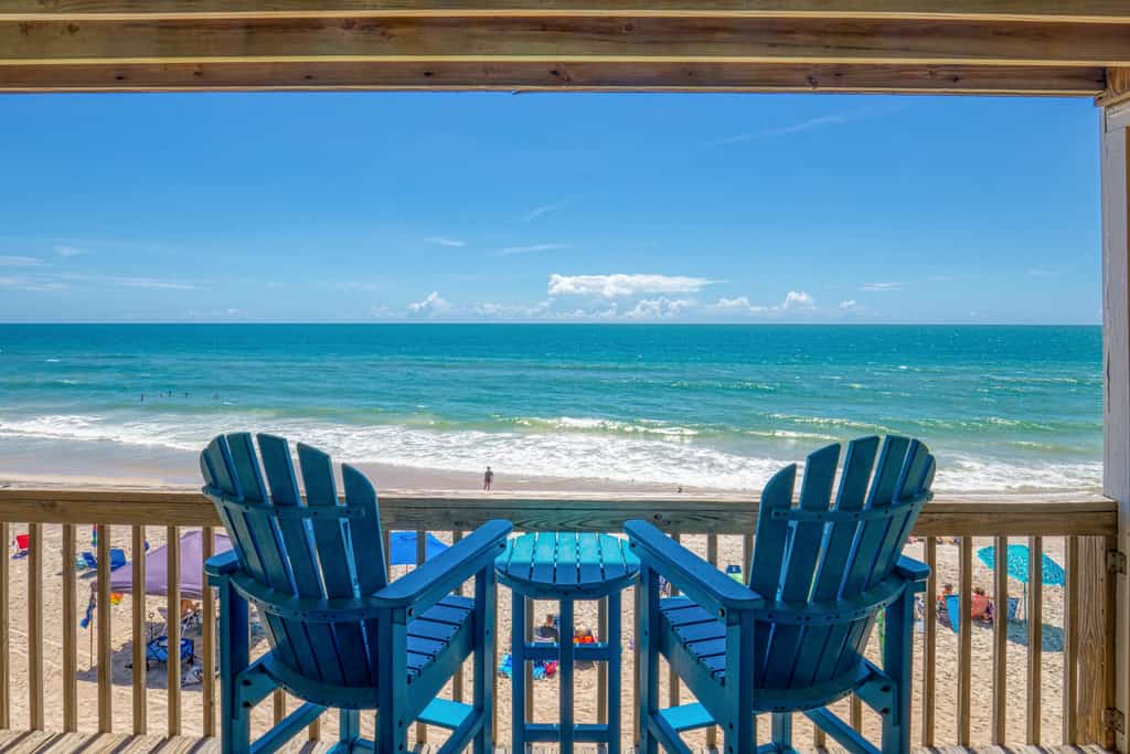 Oceanfront condo with beach views, private beach access, community pool, gazebo