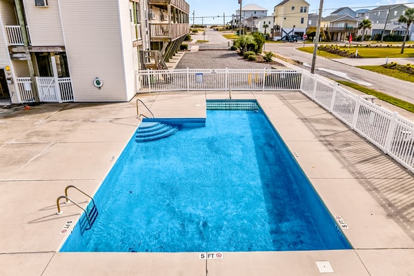 Dreamy ocean-view suite with pool, central AC, full kitchen, patio, & balcony