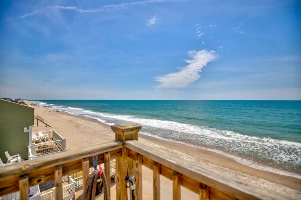 Dog-friendly duplex with ocean views, beach access, washer/dryer, central AC