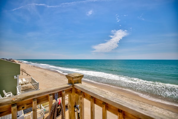 Dog-friendly duplex with ocean views, beach access, washer/dryer, central AC