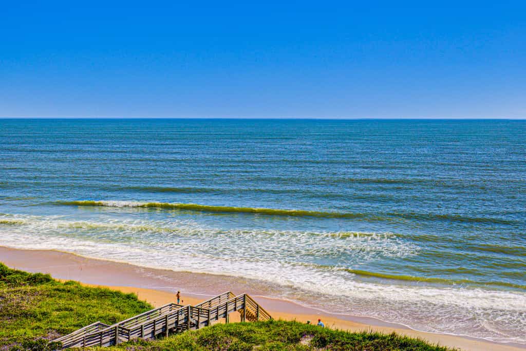 Oceanfront St. Regis condo with resort pool, gym, arcade & beach access