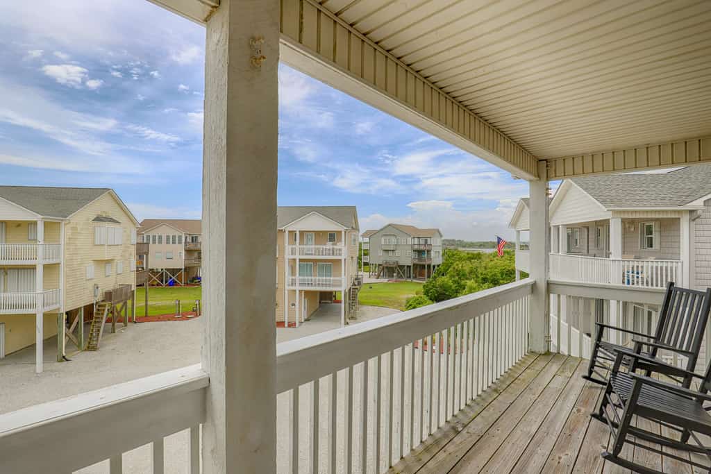 Water-view two-story duplex with multiple decks, outdoor shower, washer/dryer