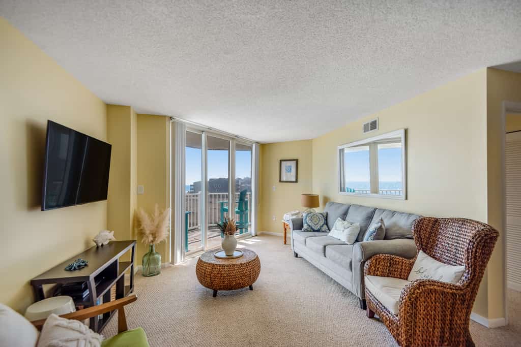 2nd-floor beachfront condo with ocean views, pool, sauna, tennis, balcony, & AC
