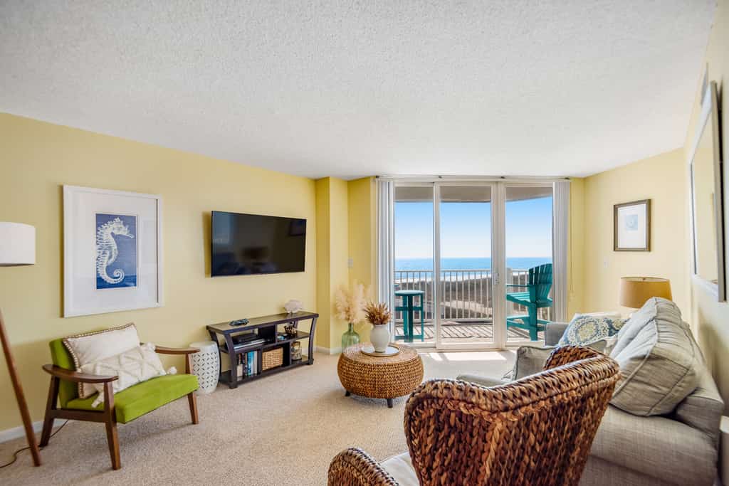 2nd-floor beachfront condo with ocean views, pool, sauna, tennis, balcony, & AC