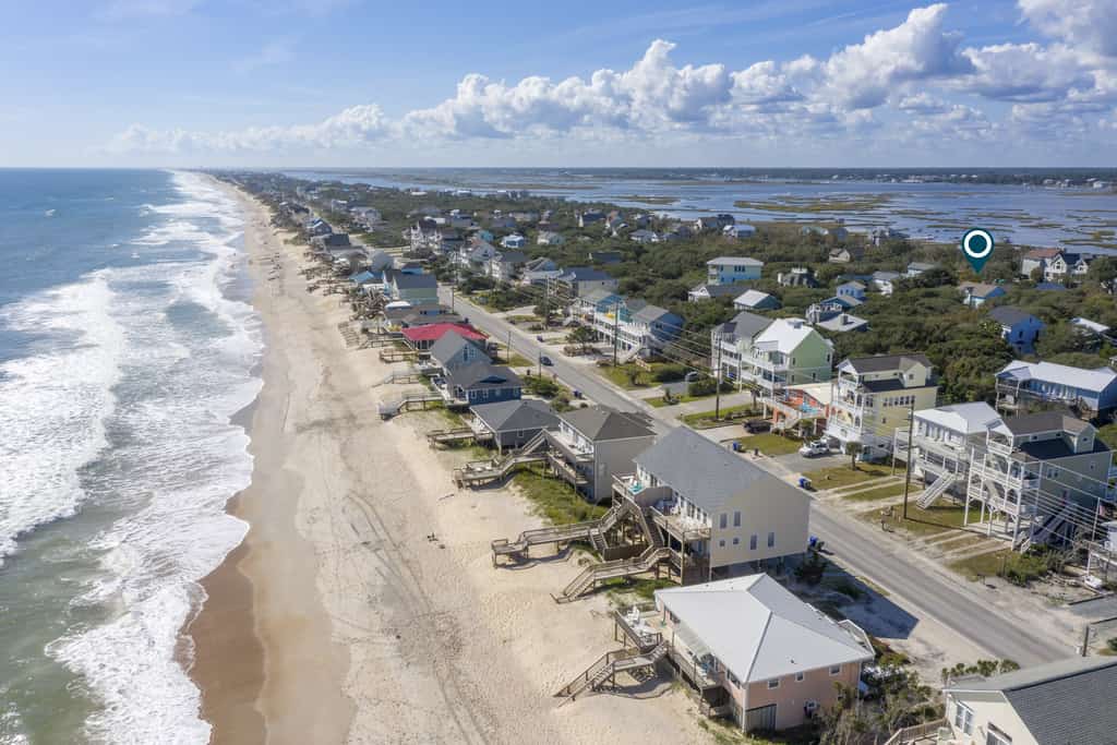 Dog-friendly coastal home with wrap-around porch and short walk to the beach