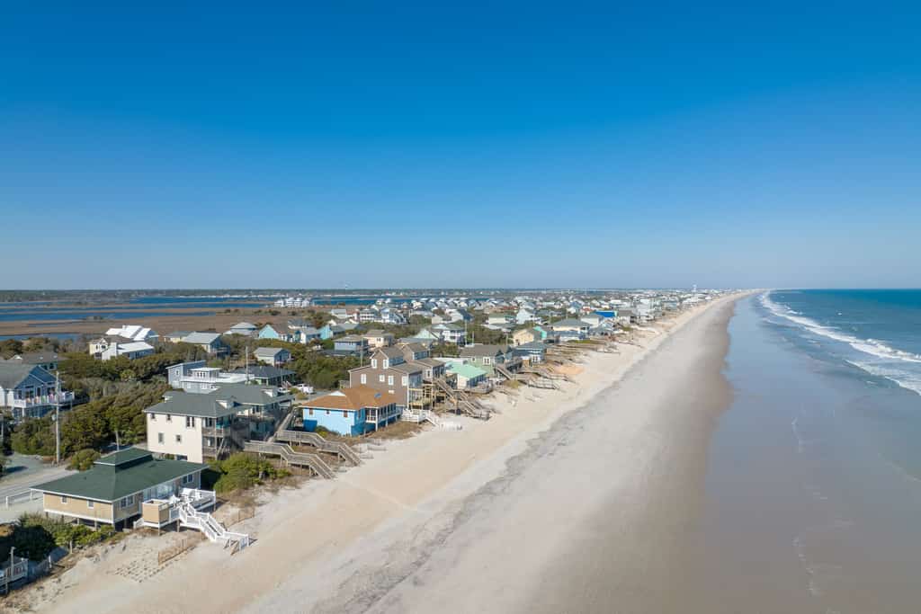 Dog-friendly coastal home with wrap-around porch and short walk to the beach