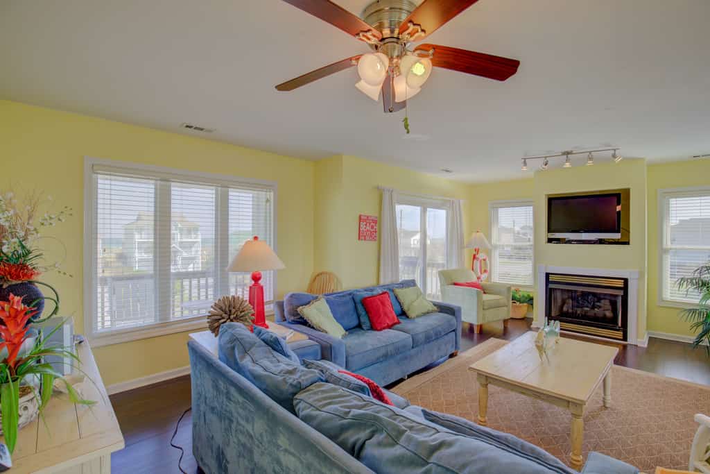 Ocean view home with a deck, washer/dryer, central AC, & gas fireplace