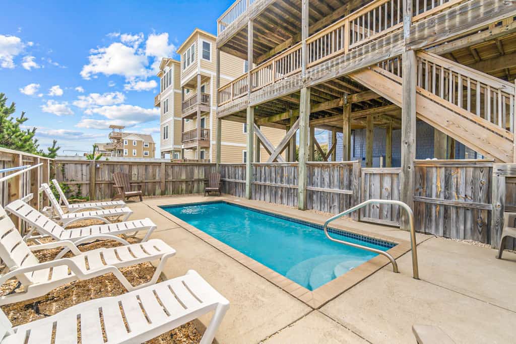 Coastal home with private pool, game room, media lounge, oceanside deck