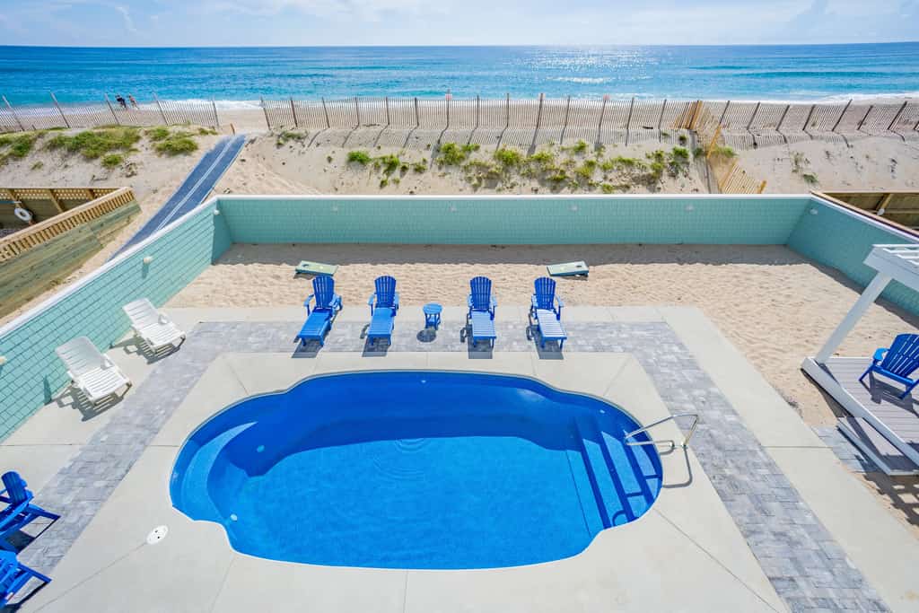 Lovely beachfront home with hot tub, pool, game room, & central AC