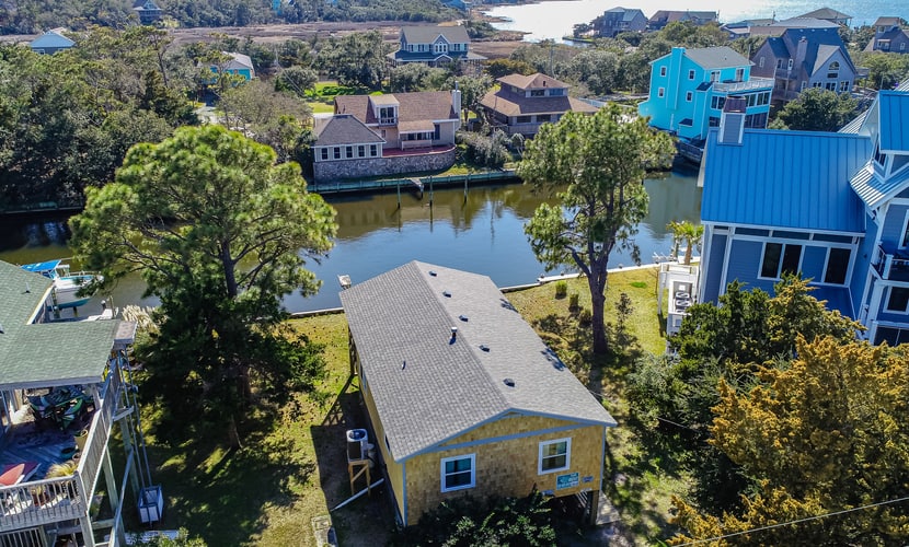 Waterfront home on a scenic canal with a dock, screened porch & fast WiFi