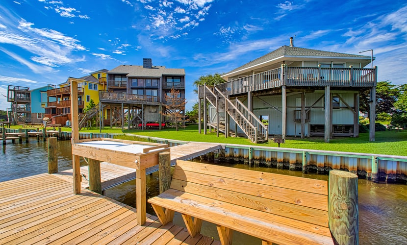 Sunny canal-front home w/deck, boat dock, private washer/dryer, & central AC