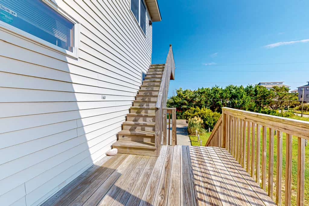 Charming water view home with pool access, decks & outdoor shower - dog-friendly