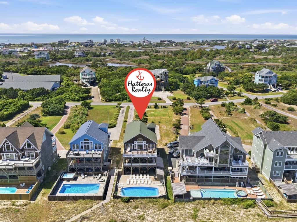 Three-story beachfront home with private pool, hot tub, decks, & ocean views