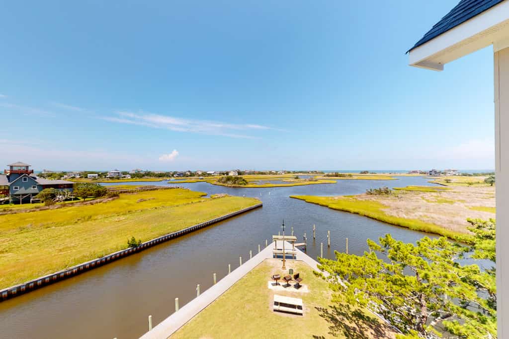 Waterfront condo with private washer/dryer, pool, water views, and free WiFi