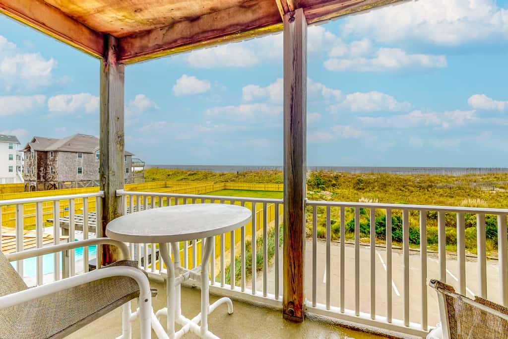 Oceanfront condo with private balcony, hot tub, outdoor pool, & pool table