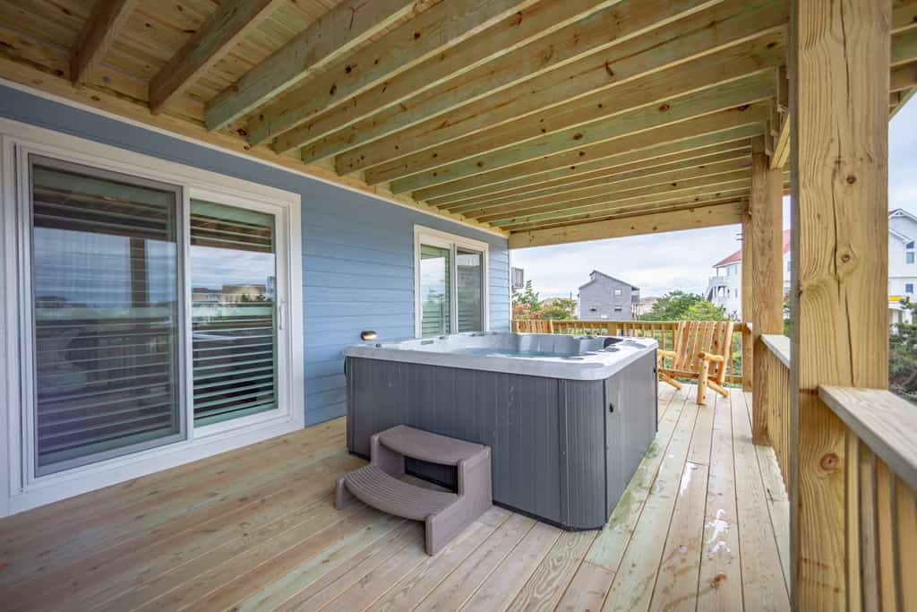 Grand beach home with elevator, private hot tub, game room, & pool access