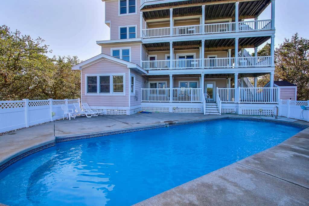 Water-view home with private pool, hot tub, game room, amazing decks, & elevator