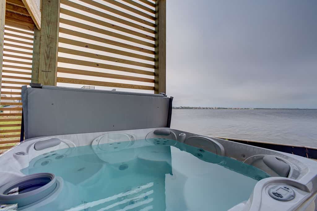 Waterfront home w/ private dock, hot tub, charcoal grill,  A/C, multiple decks