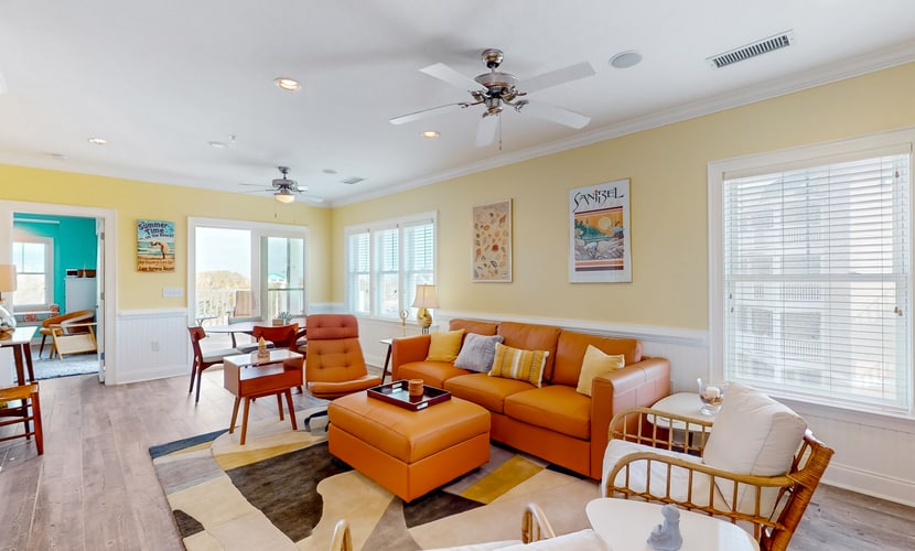 Vibrant beach retreat with washer/dryer, central AC, deck, & pool access