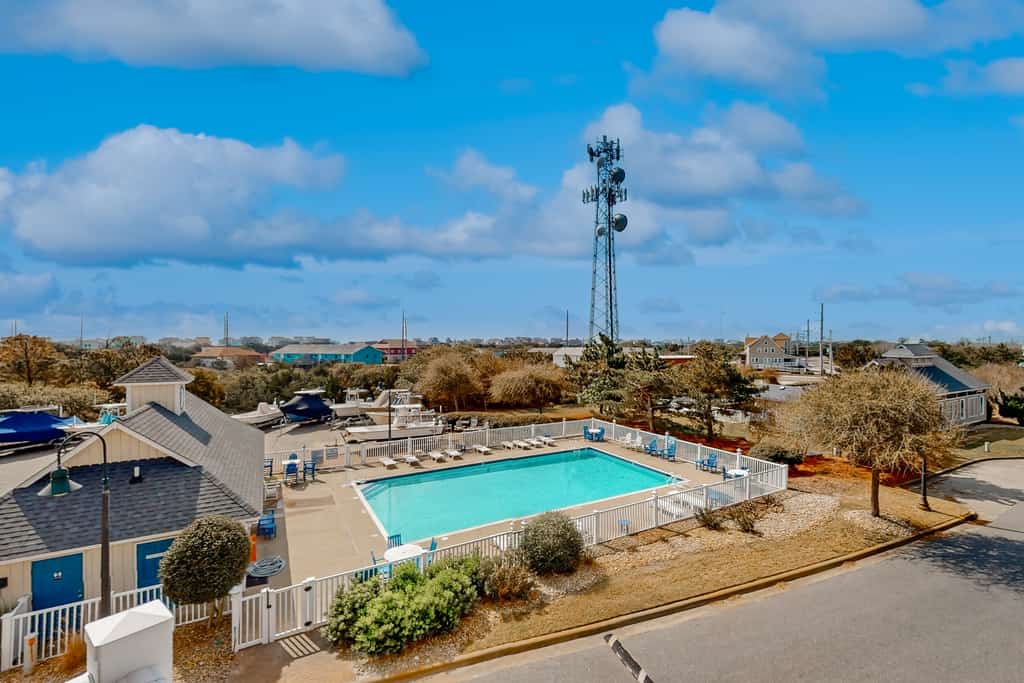 Vibrant beach retreat with washer/dryer, central AC, deck, & pool access