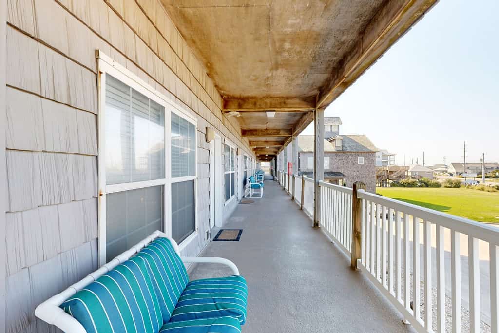 Inviting beachfront condo featuring hot tub & pool, central AC, elevator, & deck