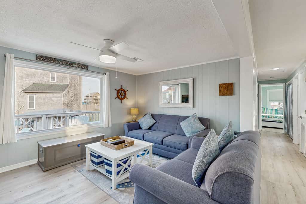 Ocean-view home steps from the beach with deck, outdoor shower, & central AC
